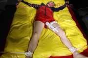 SEXY SONJA being tied and gagged on a bed stimulated with an massager wearing a hot red shiny nylon shorts and an oldschool red/blue rain jacket (Pics)