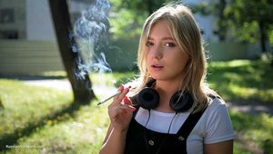 Sweet Polina is smoking 120mm cork cigarettes in the park