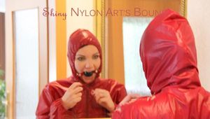 Jill ties, gagges and hoodes herself in front of a mirror and in an strairway wearing a sexy shiny nylon rain pants in black and a red rain jacket (Pics)