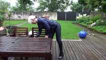 Watching sexy Courtney feeling comfortable in her dark blue  shiny nylon rainwear cleaning the table outside (Video)