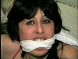 40 Yr OLD SEXY HAIRDRESSER, BANDANA CLEAVE GAGGED, NYLON STOCKING STUFFED IN HER MOUTH BAREFOOT, PANTYLESS, & HANDGAGGED WHILE GETTING A DILDO SHOVED IN HER (D52-6)