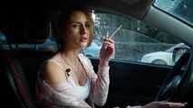 Meet Anastasia in her car while she is smoking two 120mm all white cigarettes