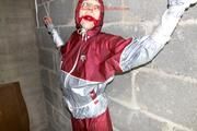 Nicole tied and gagged by Sophie in an red/silver PVC rainsuit in the cellar