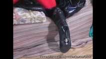 Mercedes - shiny spandex catsuit and black overknee leather boots