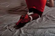 Leash chest and tied legs in red pantyhose with skirt
