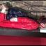 Mara tied and gagged on a princess bed in an old cellar wearing a sexy red sauna suit (Video)