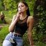 18 years old Tanya is smoking 120mm cork cigarette outdoors