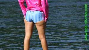 Watch Chloe enjoying her shiny nylon Shorts outside at a sunny Day