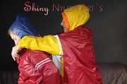 Watching sexy Sandra and Stella putting on several hot shiny nylon rainwear (Pics)