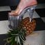 Heels crushing pineapple in the kitchen