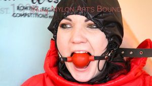 Jill tied, gagged and hooded with totally closed hood on a chair  wearing shiny downwear (Pics)