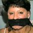 33 YEAR OLD AMERICAN INDIAN TRISH IS MOUTH STUFFED, OTM, BALL, HAND & CLEAVE GAGGED WHILE TIGHTLY TIED TO A CHAIR (D51-14)