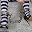 Prisoner cuffed in heavy cuffs