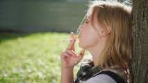 Sweet Polina is smoking 120mm cork cigarettes in the park