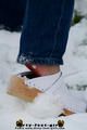 Linda with white clogs in the snow