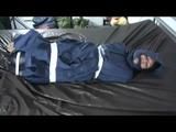 01:50 Min. video with Simone tied and gagged in a shiny nylon rainsuit and a nylon cape