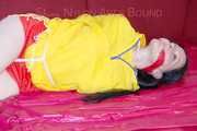 ***LUCIE*** wearing red/yellow shiny nylon shorts and a yellow shiny nylon rain jacket being bound on a sofa with ropes and a ball gag (Pics)