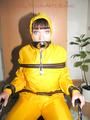 Jill tied, gagged and hooded with a tension belt on a chair wearing a supersexy yellow shiny nylon rainpants and rain jacket (Pics)