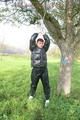 Jill tied and gagged outdoor on a tree wearing a sexy black downjacket and a black rain pants (Pics)