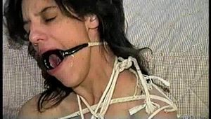 26 Yr OLD K-MART CLERK IS RING-GAGGED, BALL-TIED, IS RING GAGGED, MOUTH STUFFED, BIKINI TOP GAGGED, BALL-GAGGED, ACE BANDAGE GAGGED, BLINDFOLDED, TOE-TIED & DROOLING WHILE SITTING BALL-TIED AND NAKED ON THE FLOOR (D65-2)