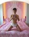 I’m making diapered selfies in a big pink bed