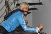Pia tied and gagged in shiny nylon clothes
