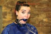 Jill tied and gagged in an old cellar on the floor wearing a shiny blue PVC sauna suit (Pics)