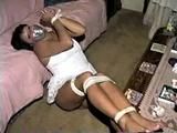 33 YEAR OLD AMERICAN INDIAN TRISH IS MOUTH STUFFED, DUCT TAPE GAGGED, BAREFOOT, & TIED UP TIGHT WITH ROPE (D64-13)