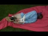 Nicole tied and gagged in an shiny pvc suit in the garden (video 0250 min)