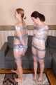 Bekki and Kelly - Sisters are taped and wrapped together face to face