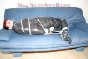 Jill tied and gagged wearing a sexy black down jacket and a sexy black rain pants (Pics)