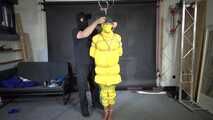 Ms Ungeniert tied, gagged and hooded in shiny nylon yellow Downjacket