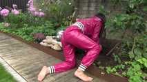 Watching Aiyana wearing supersexy pink shiny nylon rainwear while planting flowers in the garden (Video)