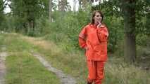 Miss Petra takes a walk in a orange AGU rain suit and rubber boots