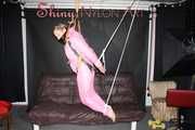 Sexy SANDRA wearing a hot pink oldschool downbib and a down jacket being tied and gagged with ropes and a clothgag hanging on the ceiling  Part 2 of 2 (Pics)