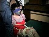 25 Yr OLD 2nd GRADE SCHOOL TEACHER GETS MOUTH STUFFED, TAPE GAGGED, BALL-TIED, HOG-TIED, WEARING A GIRDLE, TOE-TIED AND BLINDFOLDED ON THE FLOOR  (D65-12)