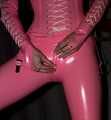 A babypink latex catsuit with Emma and a wet diaper inside