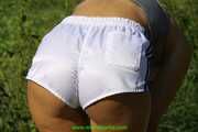 Watch Chloe enjoying her shiny nylon Shorts outside at a sunny Day