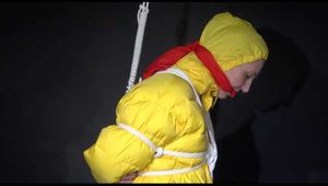 MARA wearing sexy shiny nylon rain pants and a yellow down jacket crotchroped and gagged overhead with ropes and clothgags (Video)