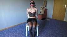 Shelli cuffed and gagged on a chair 1/2