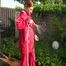 Watch Sandra watering the garden and wetting her shiny nylon oldschool Rainsuit in the Pool