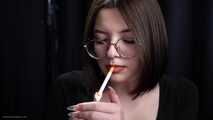 Cute 18 years old lady is smoking two cork cigarettes in the studio