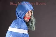 Mara tied, gagged and hooded with tape and a ball gag on a bar stool in a studio wearing a sexy oldschool lightblue downwear skibib (Pics)