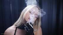 Blonde is smoking in a black leather gloves