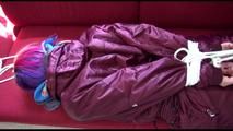 Mara tied and gagged on a red sofa wearing a sexy shiny bordeaux red oldschool skibib (Video)