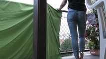 Desperation pee in jeans on balcony