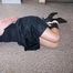 Hogtied in a black dress