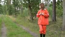 Miss Petra takes a walk in a orange AGU rain suit and rubber boots