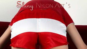 Watching our sexy archive girl wearing a sexy shiny nylon shorts posing for you (Pics)