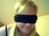 Miri is cuffed up and blindfolded